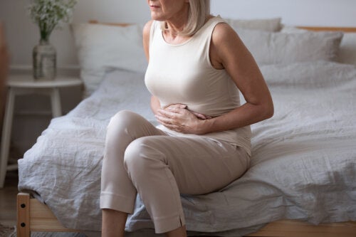 Why do women have a swollen belly at menopause